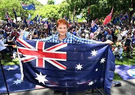 One Nation Leader Senator Pauline Hanson is seen with people attending the Australia Marches rally during Australia Day celebrations in Brisbane, Monday, January 26, 2026. (AAP Image/Darren England )